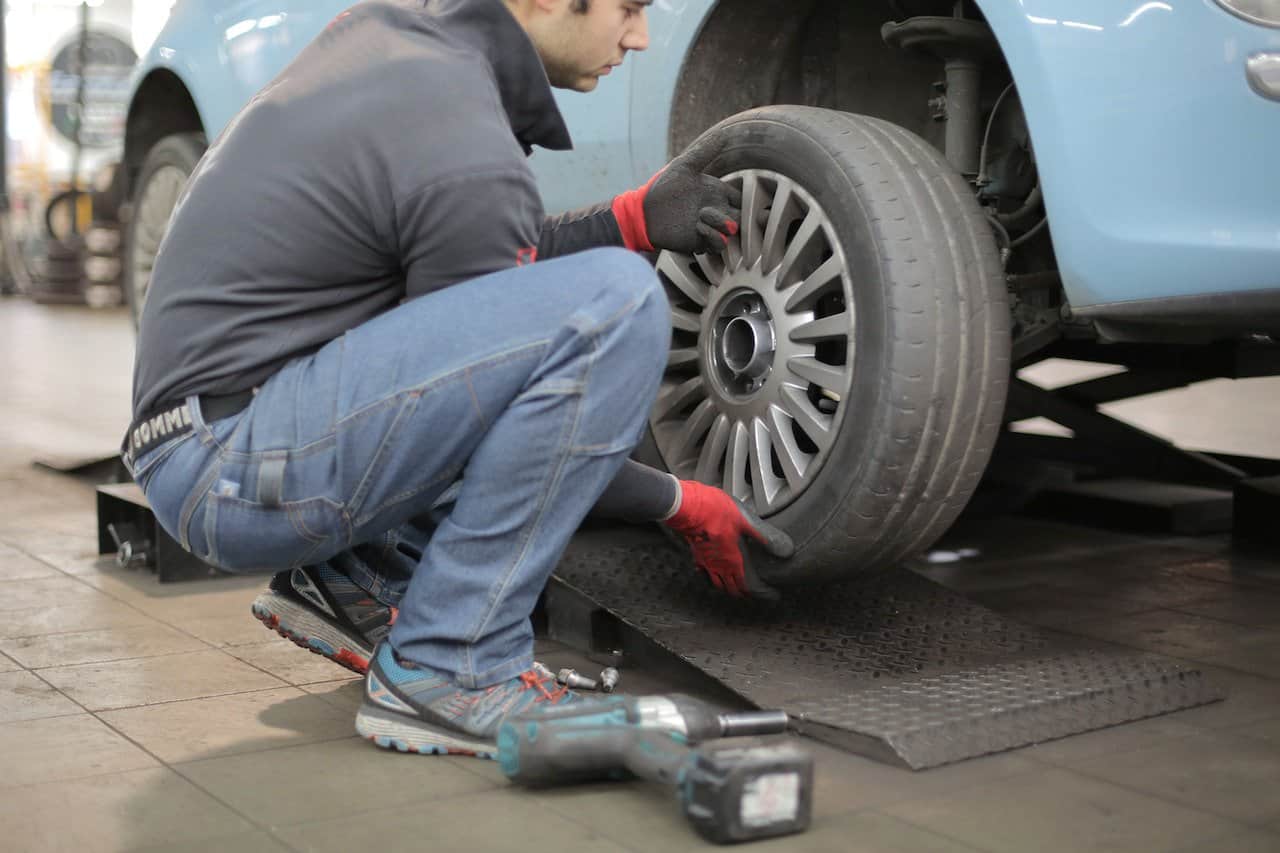 Are you left stranded on the side of the road with a flat tire? Here’s what to do next